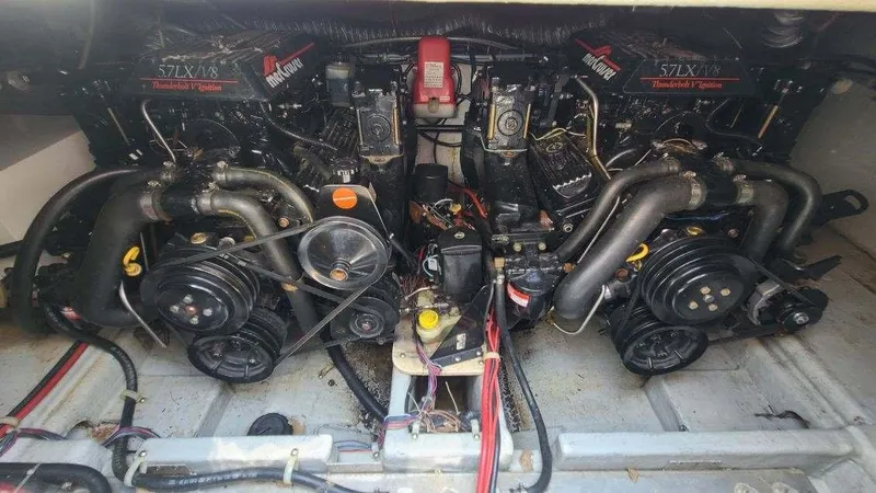 Slide: The Image of Engine compartment of a 1996 Doral 300 SC boat, featuring dual MerCruiser engines. - 7