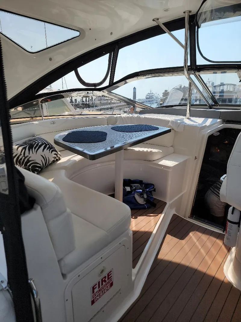 Slide: The Image of Interior of 2007 Regal Commodore 4460 yacht with seating and table. - 1