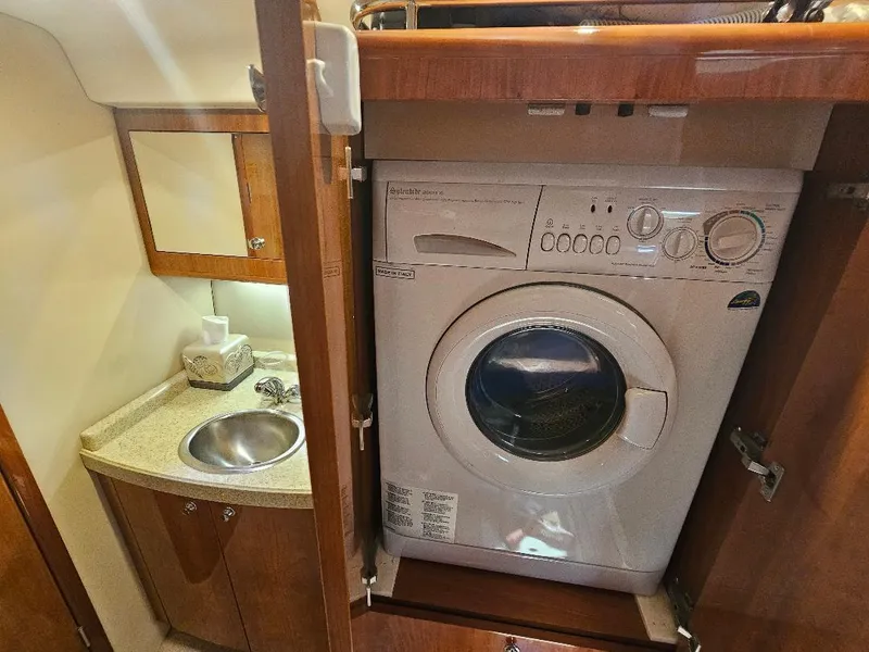 Slide: The Image of Laundry area with washer and sink in 2007 Regal Commodore 4460 yacht. - 14