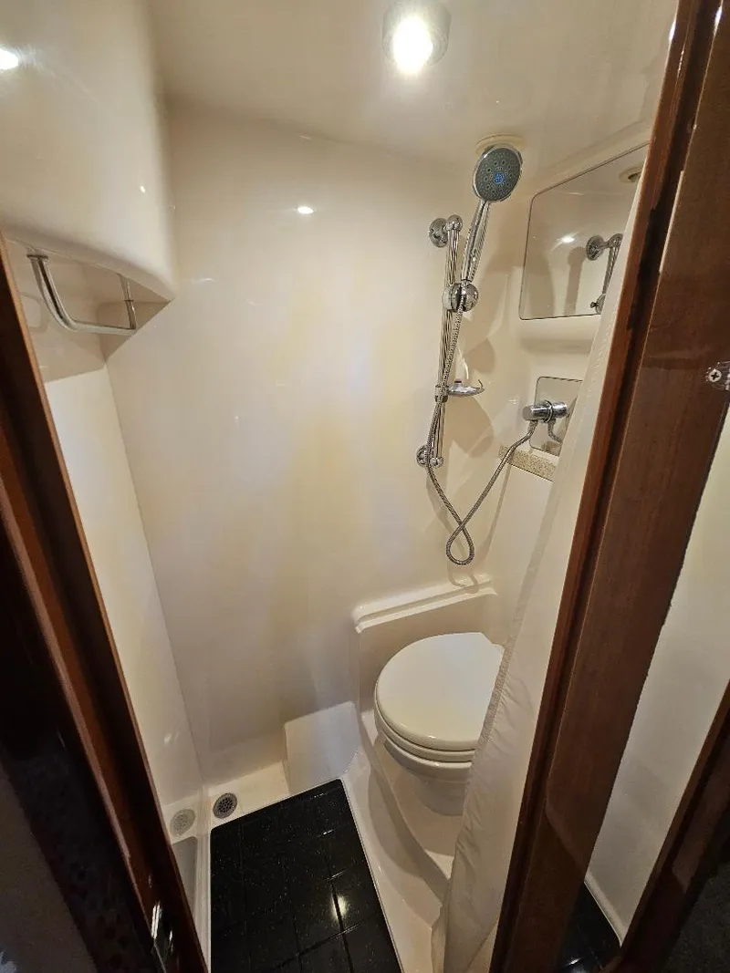 Slide: The Image of Compact bathroom in 2007 Regal Commodore 4460 yacht with shower and toilet. - 20