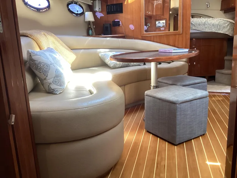 Slide: The Image of Luxurious interior of 2007 Regal Commodore 4460 yacht with leather seating and wooden flooring. - 29