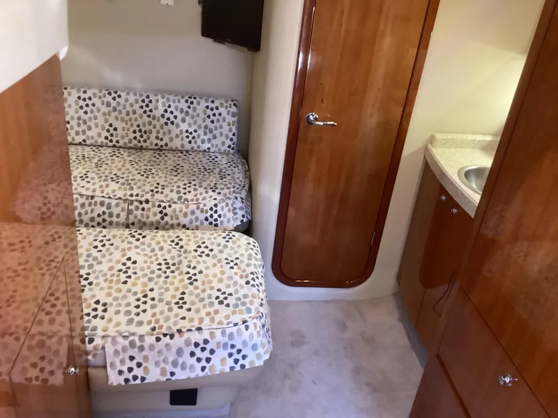 Slide: The Image of 2007 Regal Commodore 4460 cabin interior with twin beds and wooden cabinetry. - 35