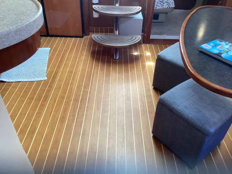 Slide: The Image of Interior of 2007 Regal Commodore 4460 yacht with wooden flooring and modern seating. - 38