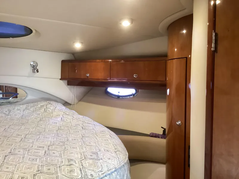 Slide: The Image of Luxurious cabin interior of 2007 Regal Commodore 4460 yacht with wood cabinetry. - 43
