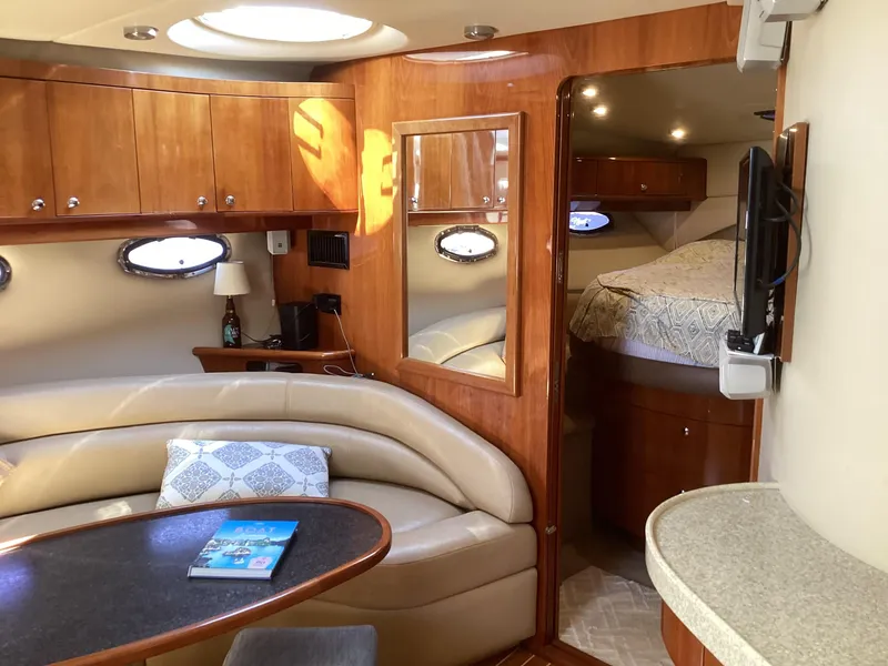 Slide: The Image of Luxurious interior of 2007 Regal Commodore 4460 yacht with cozy seating and elegant wood finishes. - 45