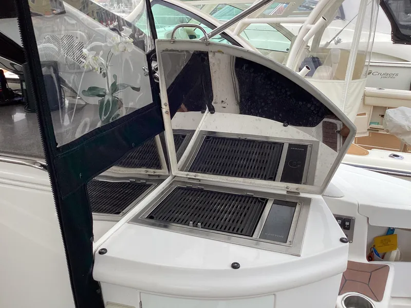 Slide: The Image of 2007 Regal Commodore 4460 yacht with open grill station on deck. - 49