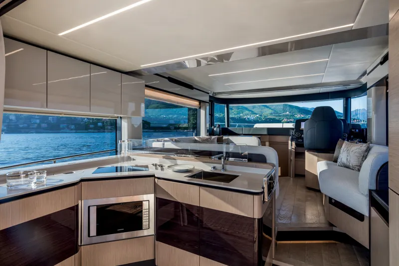 Slide: The Image of Modern interior of 2025 Absolute 48 Navetta yacht with panoramic windows and sleek kitchen. - 10