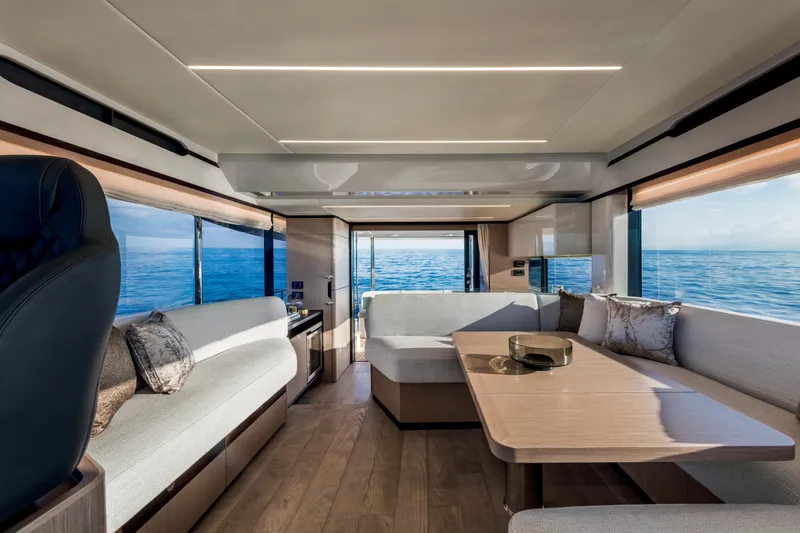 Slide: The Image of Interior of 2025 Absolute 48 Navetta yacht with modern furnishings and ocean view. - 11