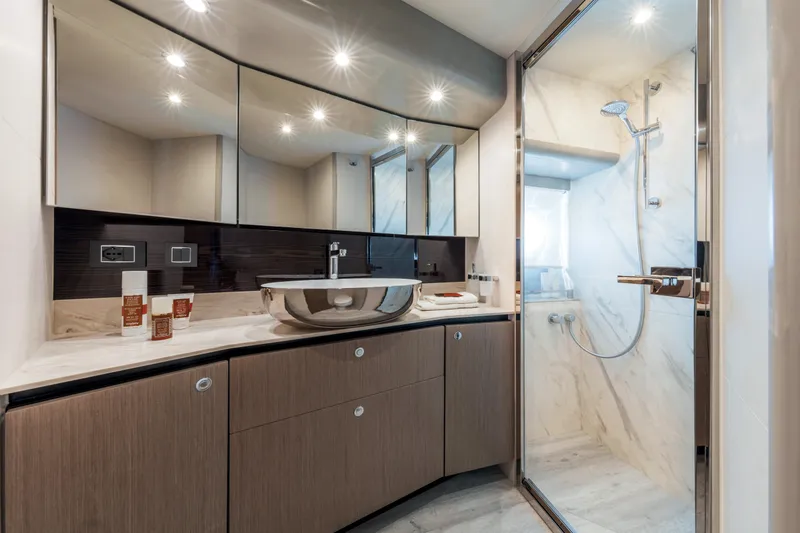 Slide: The Image of Luxurious bathroom in 2025 Absolute 48 Navetta yacht with modern fixtures and glass shower. - 13
