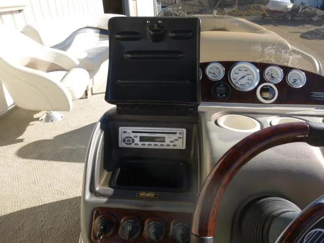 Slide: The Image of 2005 Sun Tracker Party Barge 27 I/O dashboard with stereo and gauges. - 12