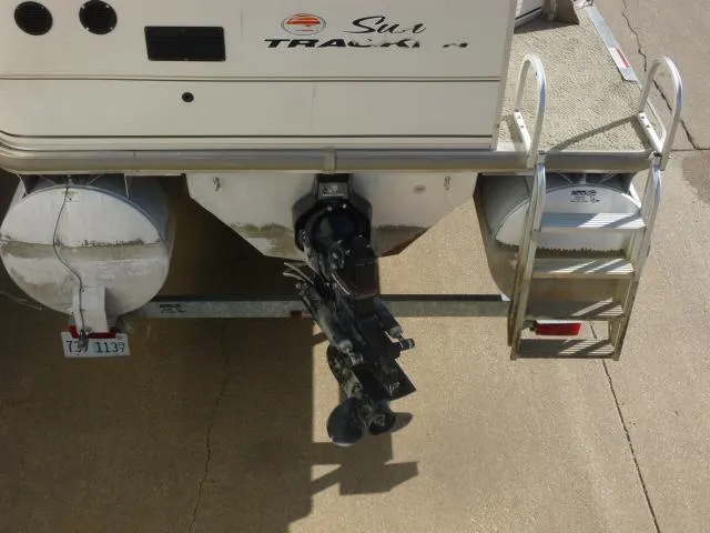 Slide: The Image of 2005 Sun Tracker Party Barge 27 I/O rear view with outboard motor and ladder. - 23