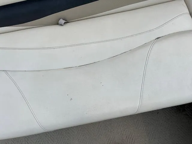 Slide: The Image of 2005 Sun Tracker Party Barge 27 I/O white boat seat with slight wear. - 32