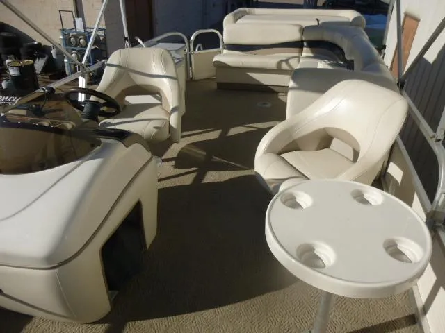 Slide: The Image of 2005 Sun Tracker Party Barge 27 I/O interior with seating and table. - 7