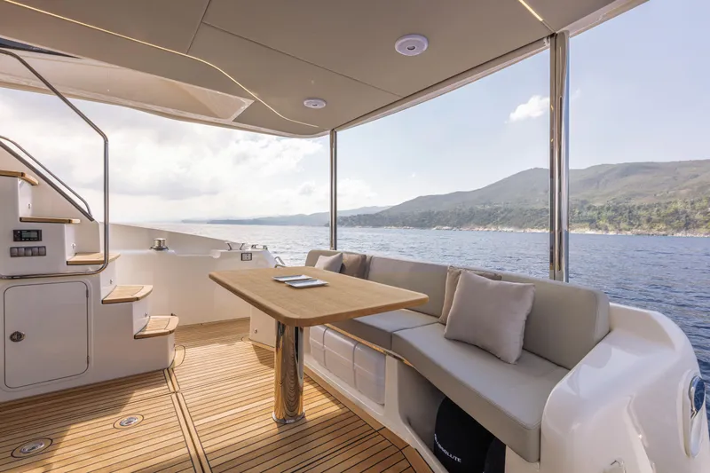 Slide: The Image of Luxurious 2025 Absolute 47 Fly yacht with spacious deck and scenic ocean view. - 14