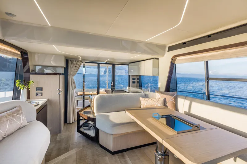 Slide: The Image of Luxurious interior of the 2025 Absolute 47 Fly yacht with panoramic ocean views. - 16
