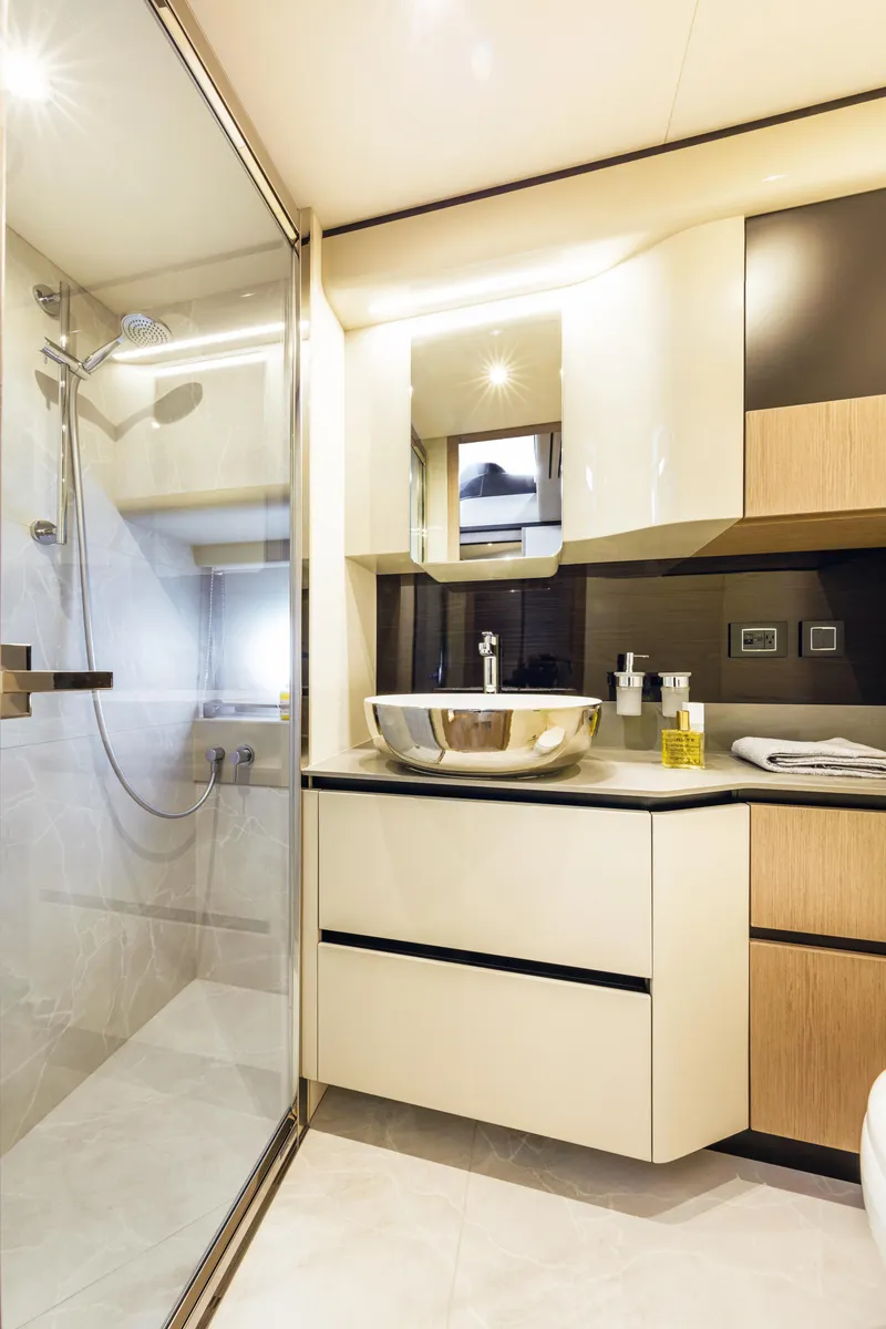 Slide: The Image of Modern bathroom in 2025 Absolute 47 Fly yacht with glass shower and sleek fixtures. - 5