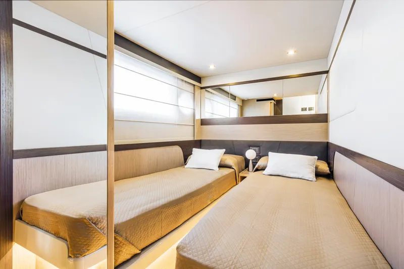 Slide: The Image of Luxurious twin bedroom in the 2025 Absolute 47 Fly yacht. - 6
