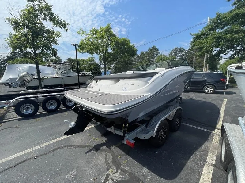 Slide: The Image of 2023 Sea Ray 190 SPX boat on a trailer in a parking lot. - 3