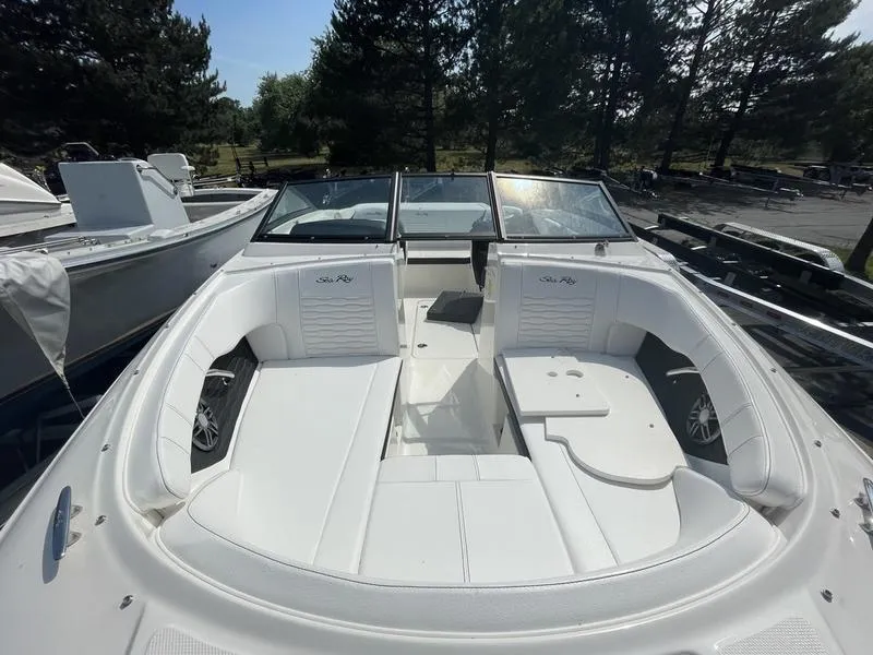Slide: The Image of 2023 Sea Ray 190 SPX boat with white interior and spacious seating. - 7