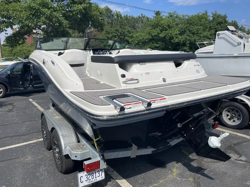 Slide: The Image of 2023 Sea Ray 190 SPX boat on trailer in parking lot. - 8
