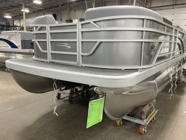 Slide: The Image of 2025 Bennington 188 SL L Bench Pontoon in a warehouse. - 3