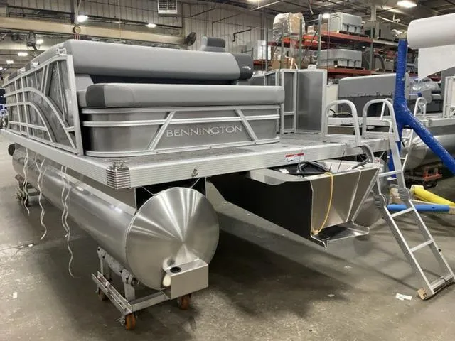 Slide: The Image of 2025 Bennington 188 SL L Bench Pontoon boat in a factory setting. - 4