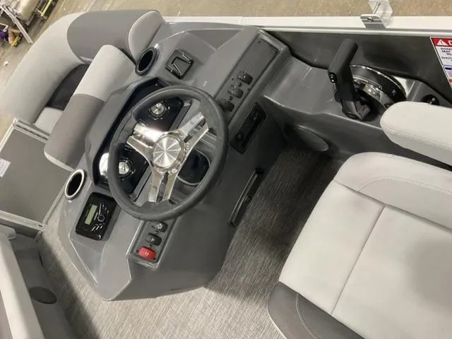 Slide: The Image of 2025 Bennington 188 SL - L Bench - Pontoon boat interior dashboard and steering wheel. - 9
