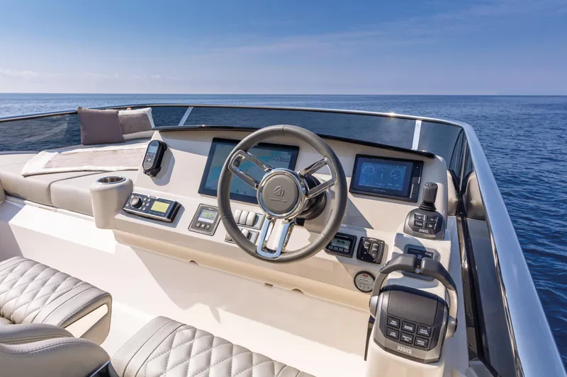 Slide: The Image of Helm of the 2025 Absolute 47 Fly yacht with modern navigation equipment. - 12
