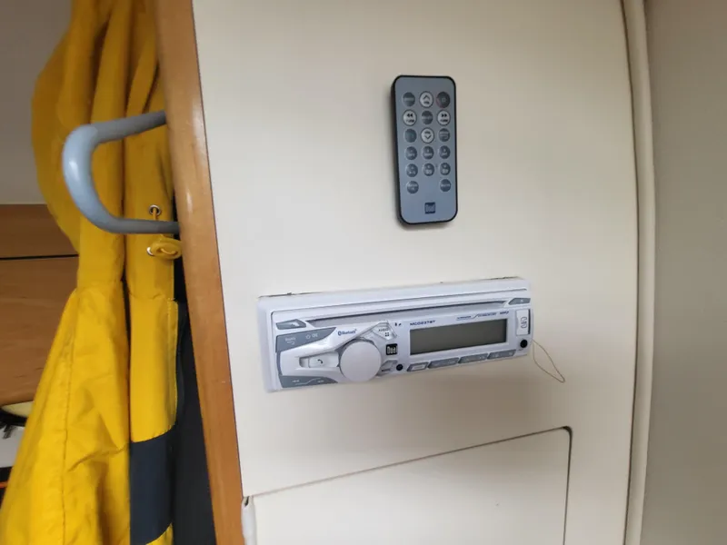 Slide: The Image of Boat interior with stereo system and remote, Larson Cabrio 290, 2000 model. - 20