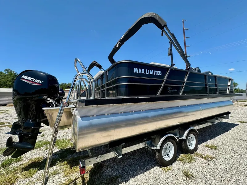 Slide: The Image of 2024 Massimo Marine P24-Limited Max pontoon boat on trailer with Mercury outboard motor. - 3