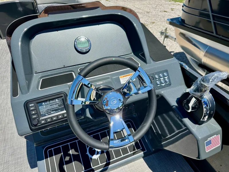 Slide: The Image of 2024 Massimo Marine P24-Limited Max boat dashboard with steering wheel and control panel. - 7