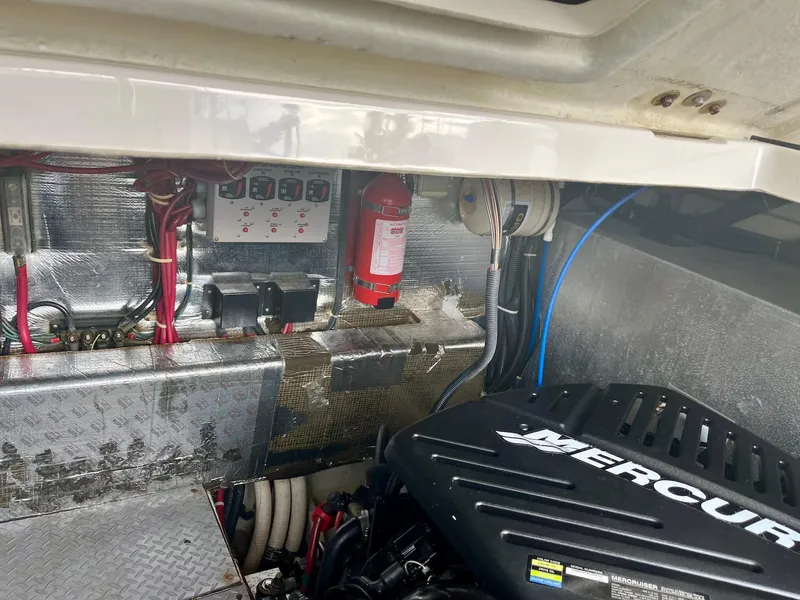 Slide: The Image of Engine compartment of a 2003 Regal Commodore 3860 boat with Mercury engine. - 15