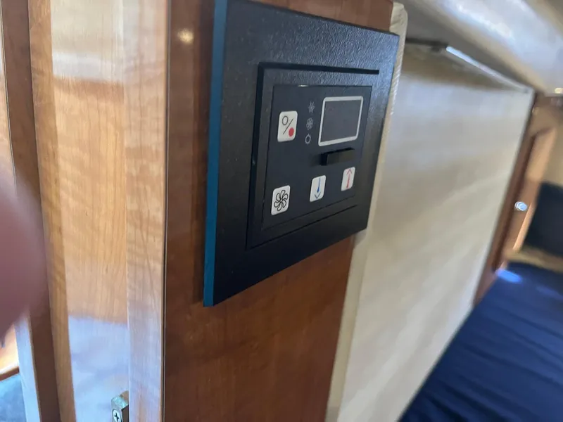 Slide: The Image of Control panel inside a 2003 Regal Commodore 3860 yacht. - 17