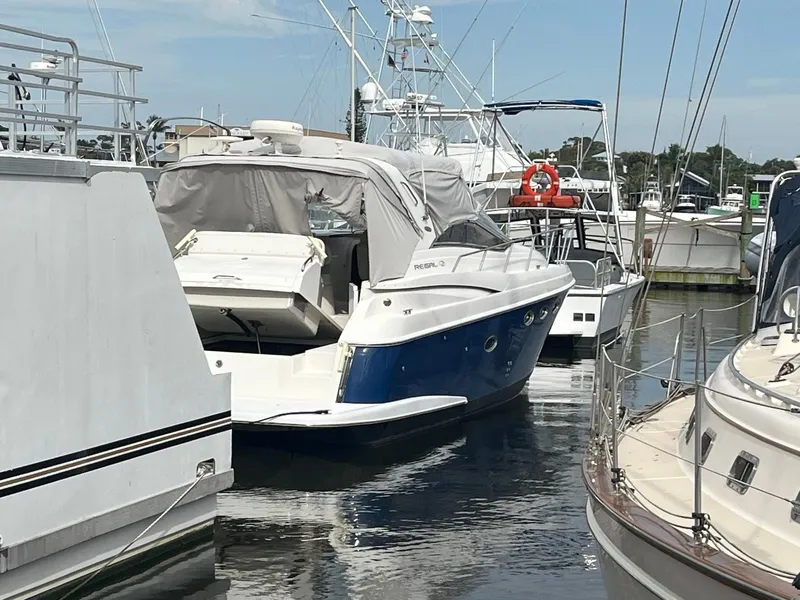 Slide: The Image of 2003 Regal Commodore 3860 yacht docked at marina. - 2
