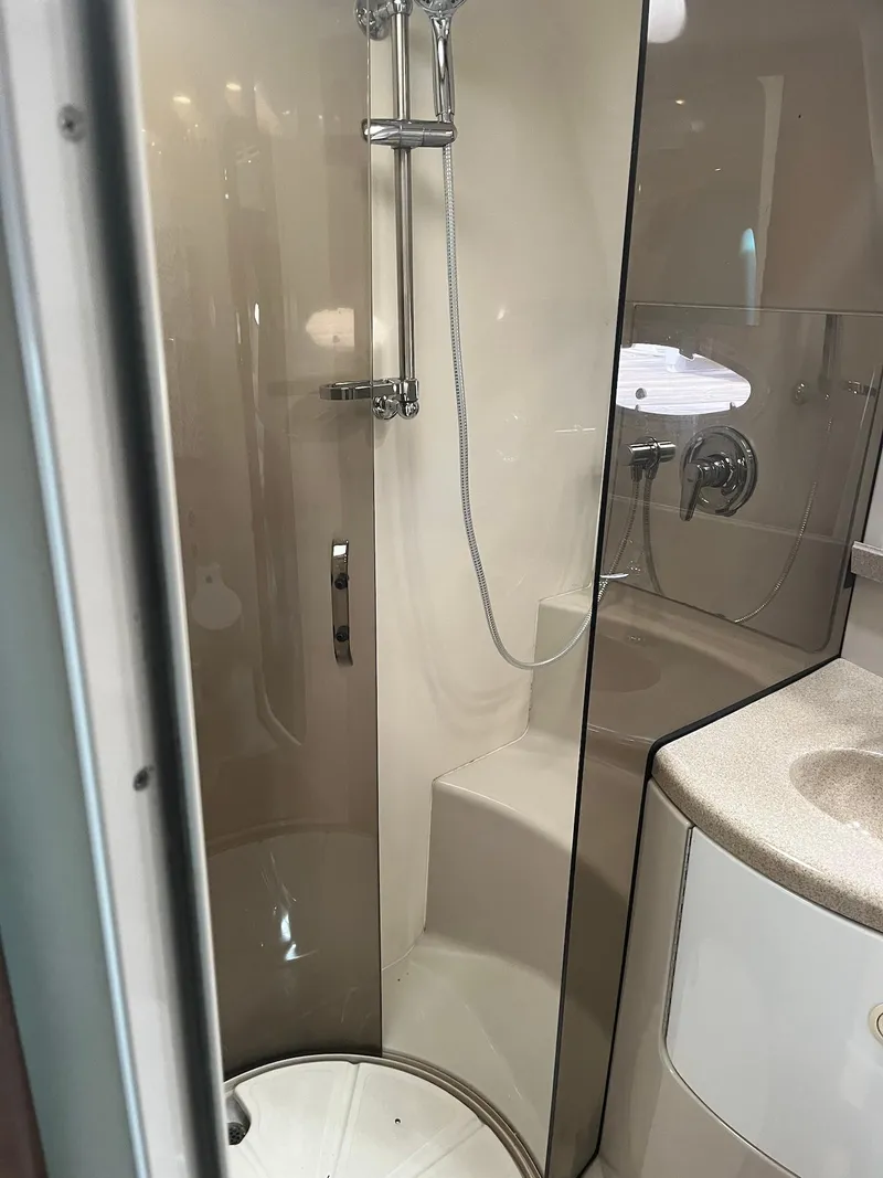 Slide: The Image of 2003 Regal Commodore 3860 bathroom with shower and sink. - 25