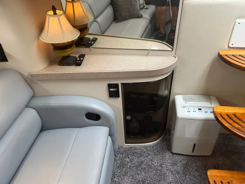 Slide: The Image of Interior of 2003 Regal Commodore 3860 with seating, lamps, and dehumidifier. - 27