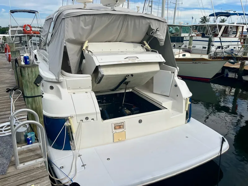 Slide: The Image of 2003 Regal Commodore 3860 yacht docked with engine compartment open. - 9