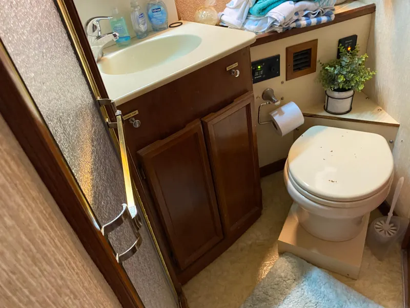 Slide: The Image of Bathroom interior of 1990 Egg Harbor 42 Golden Egg yacht, featuring sink and toilet. - 10