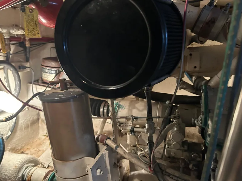 Slide: The Image of Engine room of a 1990 Egg Harbor 42 Golden Egg boat, showing mechanical components. - 15