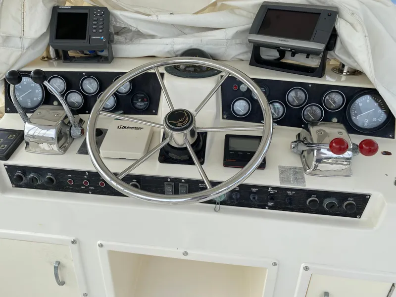 Slide: The Image of Luxurious interior of a 1990 Egg Harbor 42 Golden Egg yacht with leather seating and wooden accents. - 7