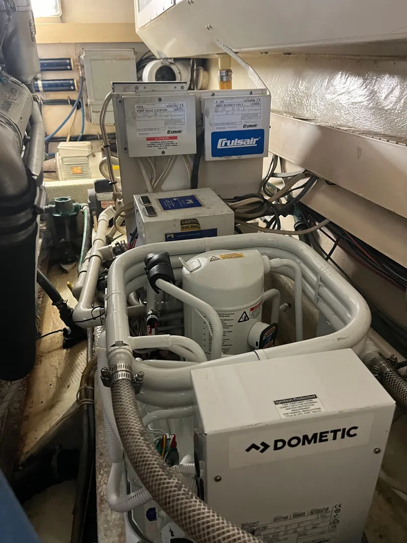 Slide: The Image of Engine room of a 1989 Viking 57 Convertible yacht with Dometic and Cruisair equipment. - 13