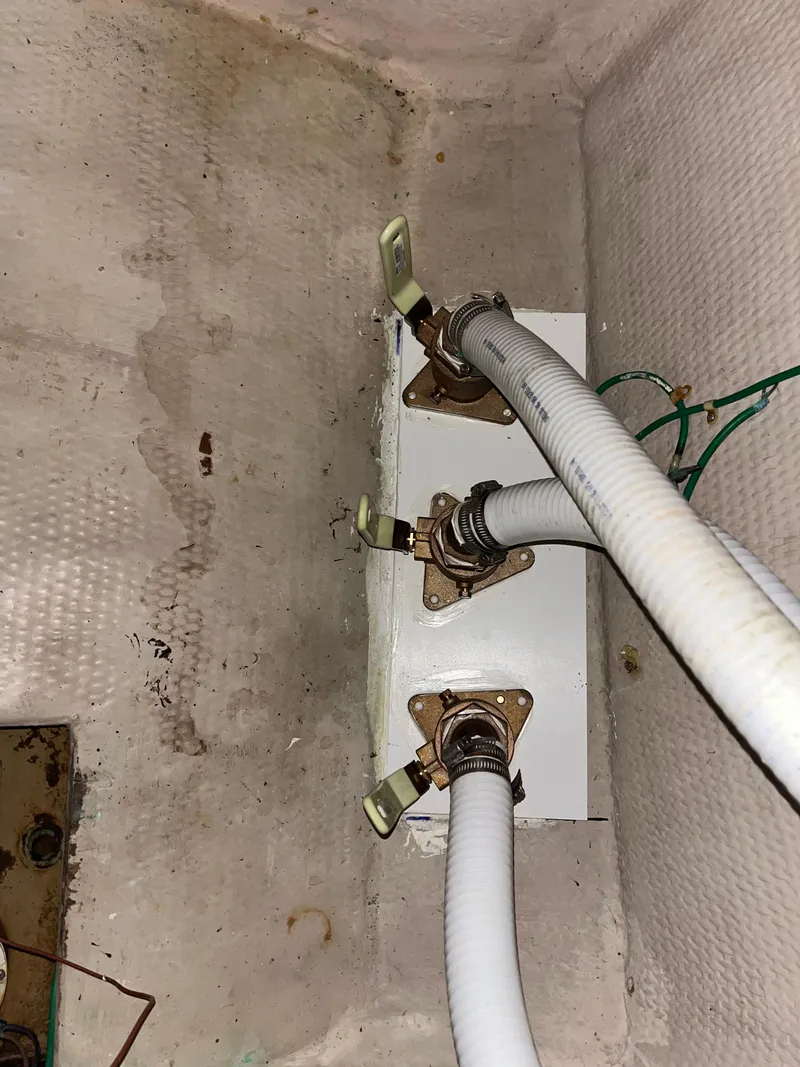 Slide: The Image of 1989 Viking 57 Convertible boat plumbing system with hoses and valves - 14