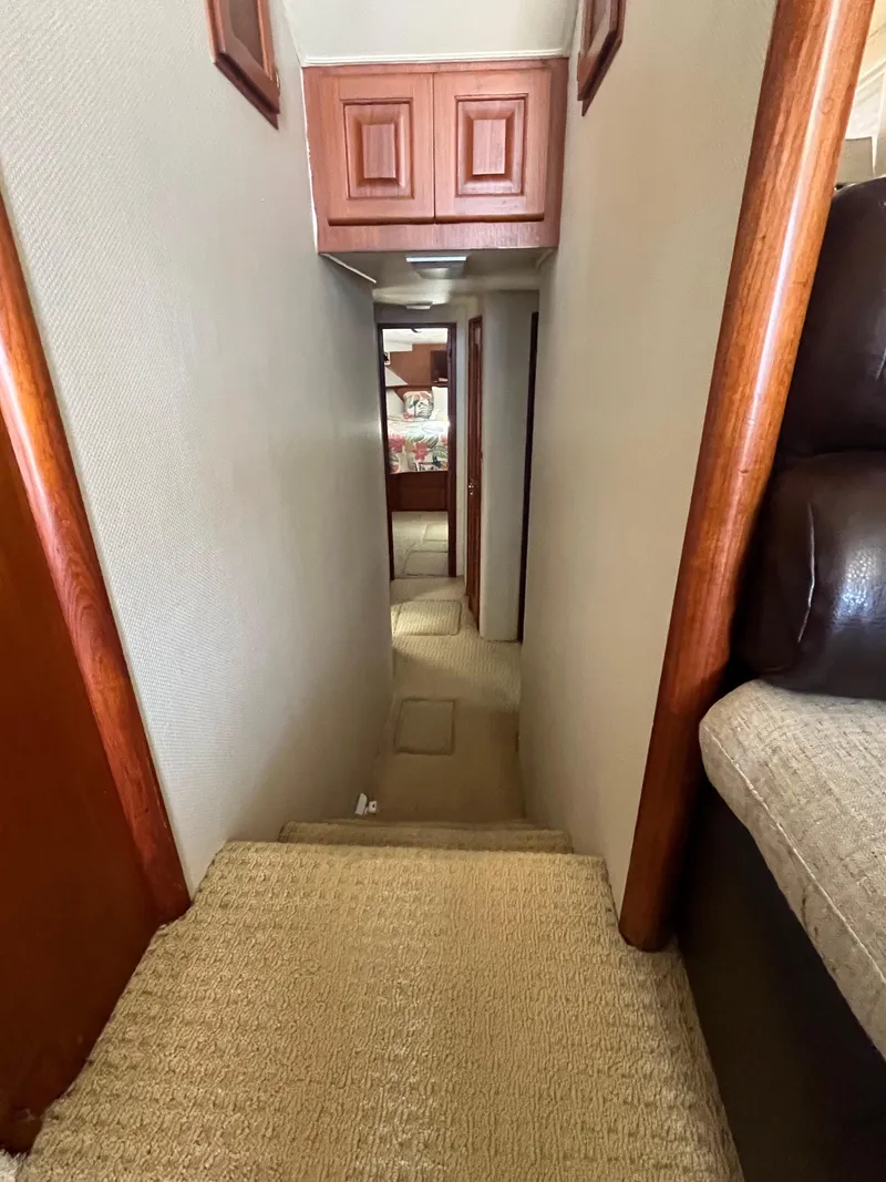 Slide: The Image of Narrow hallway inside a 1989 Viking 57 Convertible yacht. - 7
