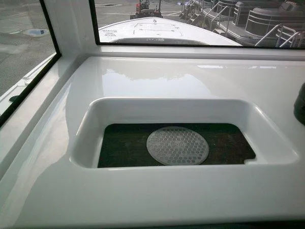 Slide: The Image of 2024 Sportsman 267OE boat interior with a built-in sink. - 11