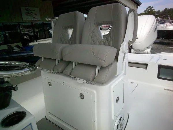 Slide: The Image of 2024 Sportsman 267OE boat with dual cushioned seats. - 13