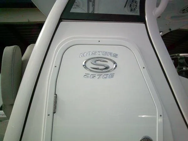 Slide: The Image of 2024 Sportsman Masters 267OE boat console with logo. - 17