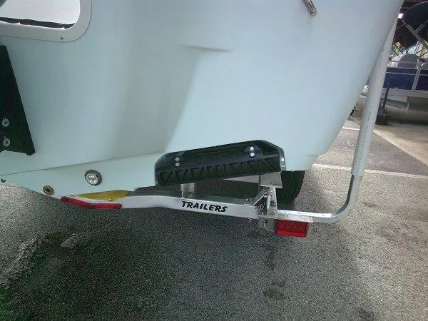 Slide: The Image of 2024 Sportsman 267OE boat trailer rear view in parking lot. - 18