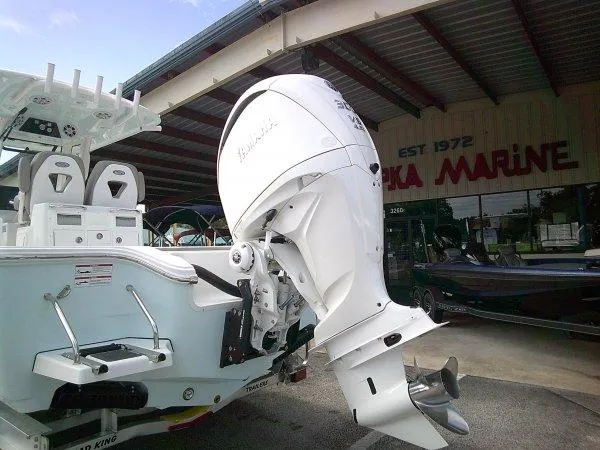 Slide: The Image of 2024 Sportsman 267OE boat with powerful outboard motor at marina. - 20