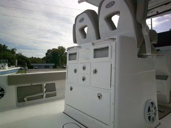 Slide: The Image of 2024 Sportsman 267OE boat interior with dual seats and storage compartments. - 3