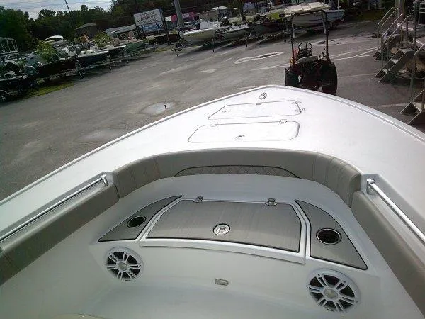 Slide: The Image of 2024 Sportsman 267OE boat bow with storage compartments and speakers. - 8